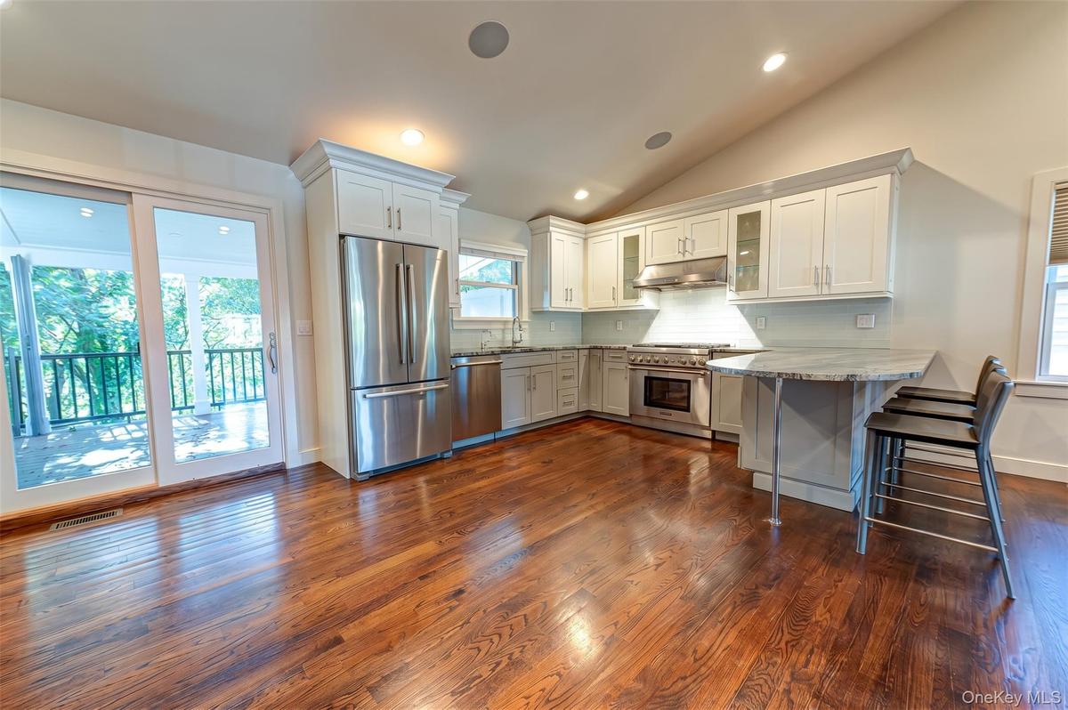 Open Floor Plan perfect for entertaining and daily living! Sliders to deck.