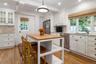 View of the kitchen showing access to the garden, patio and garage.