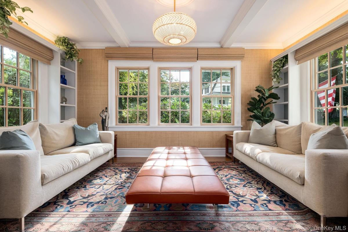 Sun Room featuring coffered ceiling, three exposure