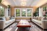 Sun Room featuring coffered ceiling, three exposure
