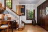 Entrance hall featuring two closets and hardwood floors.