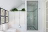 Ensuite featuring separate shower and built-in cabinetry.