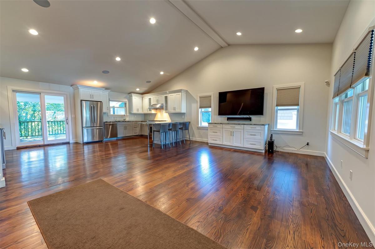 Vaulted Ceiling and Gleaming Hardwood Flooring Throughout!