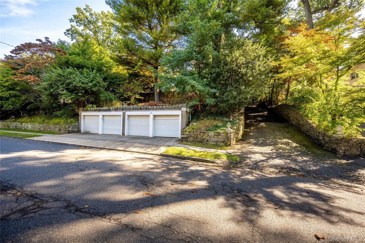 4 car detached garage and driveway that accommodates many cars.