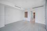 Neutral interior featuring wood-finish flooring, recessed ceiling linear diffusers, and a built-in recessed wall niche