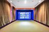 Recreation room featuring an integrated projection system, recessed ceiling lighting, surround sound speakers, and acoustic wall paneling