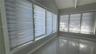 Vaulted ceiling featuring a central support beam, large windows with horizontal roller shades, and polished tile flooring
