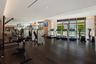 Fitness center featuring floor-to-ceiling windows, dark wood-finish flooring, recessed lighting, and wall-to-wall mirror paneling