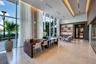 Floor-to-ceiling windows, polished stone flooring, recessed ceiling lighting, and built-in wall shelving
