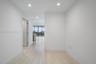 Interior space featuring large-format tile flooring, recessed lighting, and expansive floor-to-ceiling windows