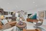 Open-concept area featuring recessed ceiling lighting, light-toned tile flooring, custom cabinetry, and a floating staircase with a metal handrail