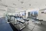 Fitness center featuring full-height wall mirrors, rubberized tile flooring, floor-to-ceiling windows, and recessed ceiling lighting