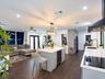 Kitchen featuring a central island with a built-in wine refrigerator, quartz countertops, wood-finish flooring, recessed lighting, and a modern indust