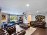 Open-concept living space featuring wood-finish flooring, recessed lighting, and a ceiling fan