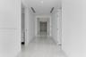 Hallway featuring polished tile flooring, recessed ceiling lighting, and integrated linear fixtures