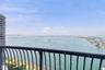 Private balcony with black metal railing and unobstructed panoramic water scenery