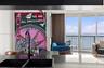 Kitchen island with solid surface countertop, matte black dual-basin undermount sink, and high-arc faucet, featuring floor-to-ceiling windows and ribb