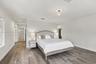 Neutral-toned room featuring wood-finish flooring, recessed lighting, and a flush-mount overhead fixture