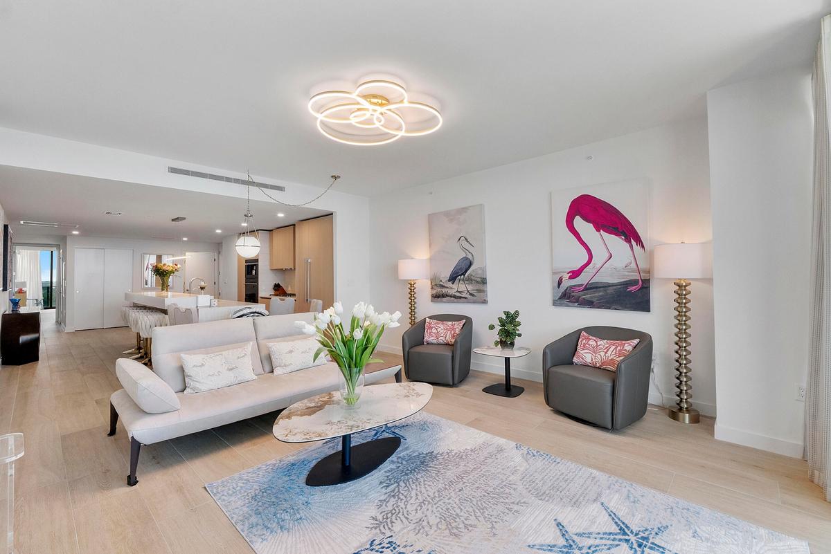 Experience refined coastal luxury in this beautifully appointed open-concept living space. Contemporary furnishings, elegant finishes, and a bright, a