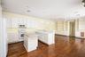 beautiful wood floors, white kitchen, island storage custom shelves