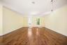 extended living room, wood floors, dining room front foyer and wet bar