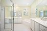 Double sinks, private water closet, step in glass shower, soaking tub and huge walk in closet. Additional walk in off bedroom