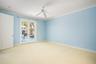 Master with custom closets and French doors to courtyard