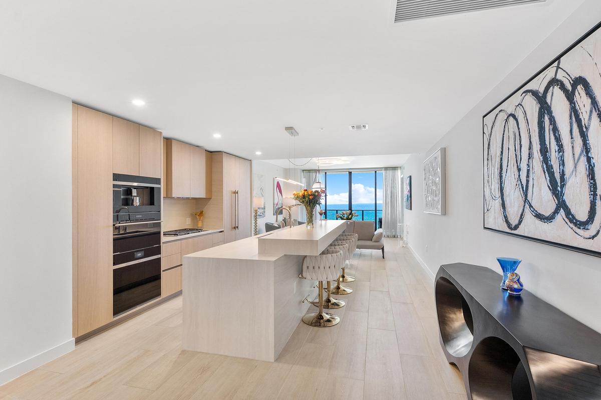 Experience seamless modern luxury with an open-concept design, exquisite kitchen finishes, and spectacular ocean views that enhance the residence’s so
