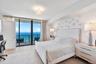 Wake up to breathtaking Atlantic Ocean views in this luxurious primary suite, offering floor-to-ceiling glass, generous proportions, and a serene coas