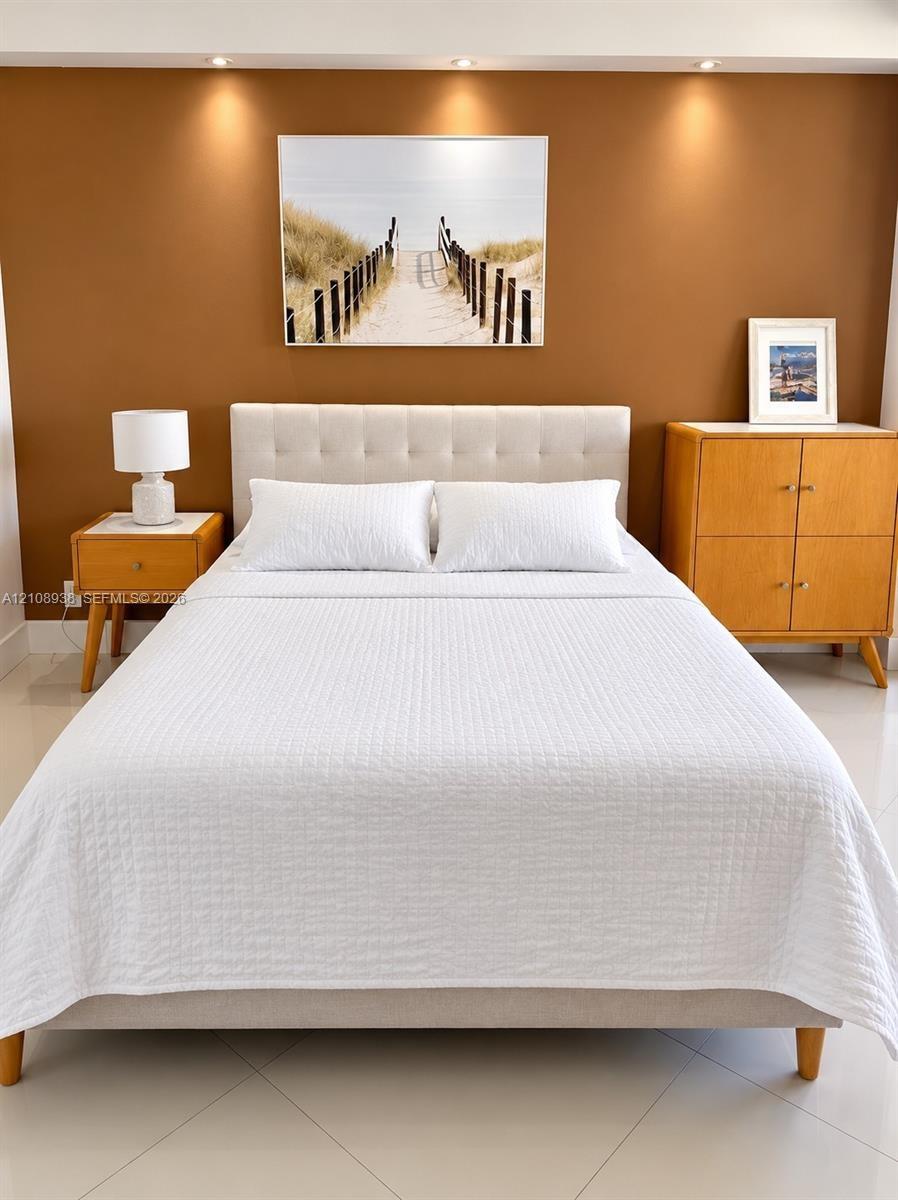 Large-format ceramic floor tiling and recessed ceiling lighting