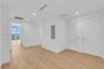 Interior space featuring wood-finish flooring, recessed lighting, and a louvered closet door