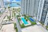 Rooftop amenities featuring a swimming pool, tennis court, and lush landscaping