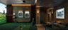 Wood-paneled walls, recessed ceiling lighting, wall-mounted display fixtures, and artificial turf flooring