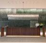 Wood-paneled reception desk with integrated lighting