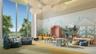 Floor-to-ceiling windows, high ceilings, custom wall mural, cloud-shaped ceiling light fixture, and built-in alcove shelving