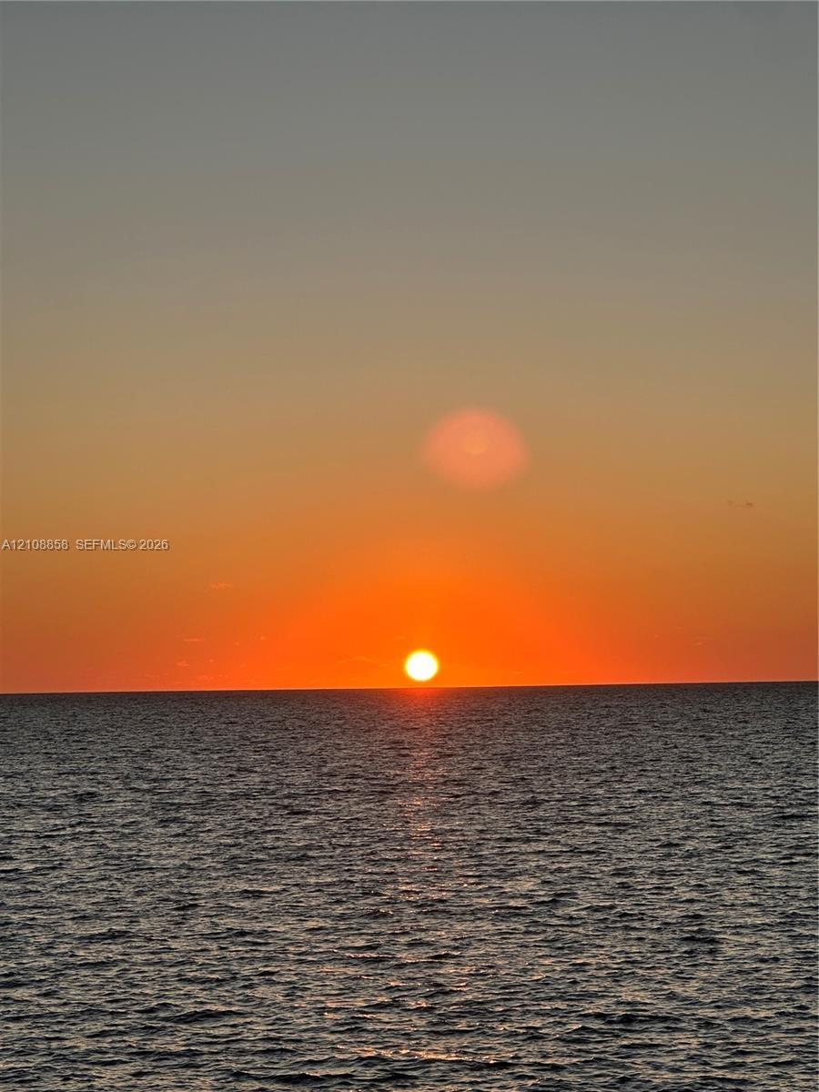 Ocean horizon featuring a prominent sunset backdrop