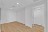 Interior space featuring wood-finish flooring, recessed lighting, and a solid-core door