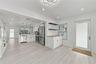 Kitchen featuring white cabinetry, stainless steel appliances, wood-finish flooring, recessed lighting, and a butcher-block countertop workspace with 