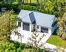 Secondary building with full bath, second set of laundry facilities, man cave, storage room & additional 30’+ deep parking.
