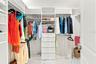 Primary bedroom walk in closet