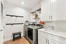 Laundry room with full sized washer and dryer