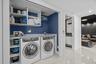 A full size laundry closet offers hidden functionality.