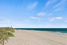 Just steps from your front door, this oceanfront residence is ideally positioned on the white sand beach between the Pompano Beach Pier and the Hillsb