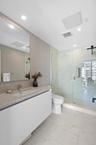 Guest bedroom 2 features more designer touches, automated blinds, customized closet, murphy bed and ensuite bathroom.