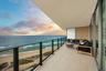 The expansive wraparound balcony offers an exceptional amount of outdoor living space and a peaceful setting to unwind with family and friends. As eve