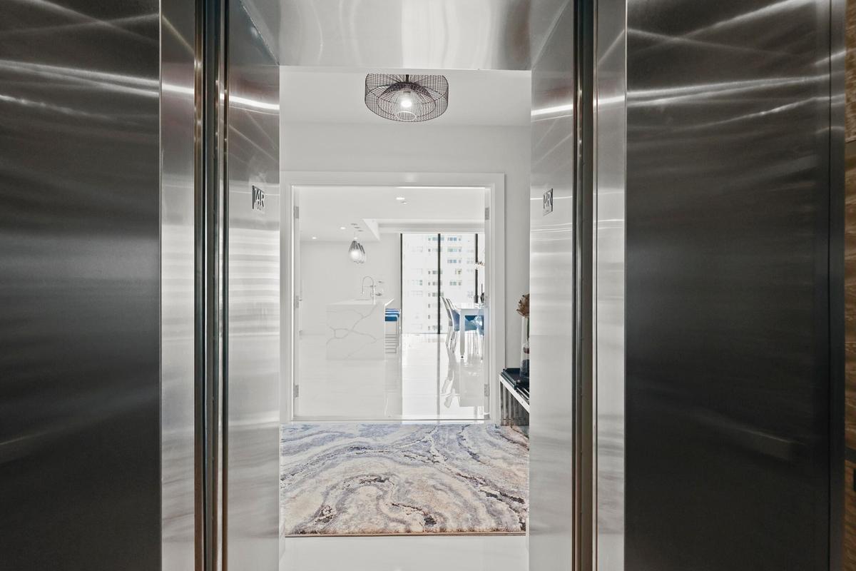 A private elevator escorts you to your 14th-floor residence overlooking the Atlantic Ocean.