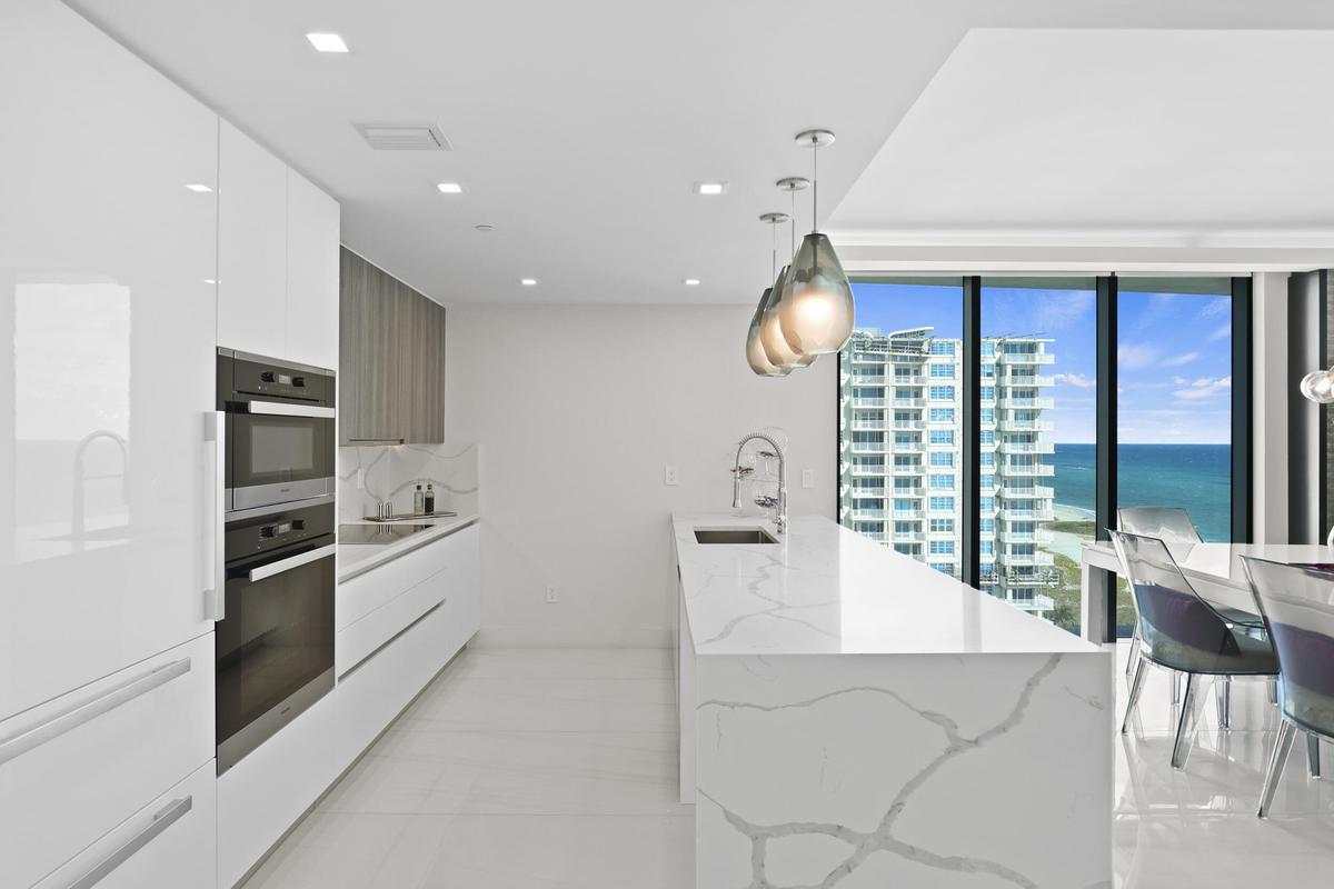 Culinary enthusiasts will enjoy a true chef's kitchen, highlighted with custom Italian cabinetry, Quartz countertops, and luxury (SubZero & Miele) app
