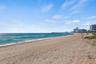 Just steps from your front door, this oceanfront residence is ideally positioned on the white sand beach between the Pompano Beach Pier and the Hillsb