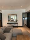 Interior space featuring wood-finish flooring, recessed lighting, and bold dark-toned door frames with matching paneled doors