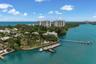 Waterfront property featuring extensive private dockage, deep-water access, seawall bulkhead, and mature coastal vegetation